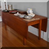 F40. Drop leaf table. Wear and damage to finish. 26”h x 45”w x 16”d - $95 